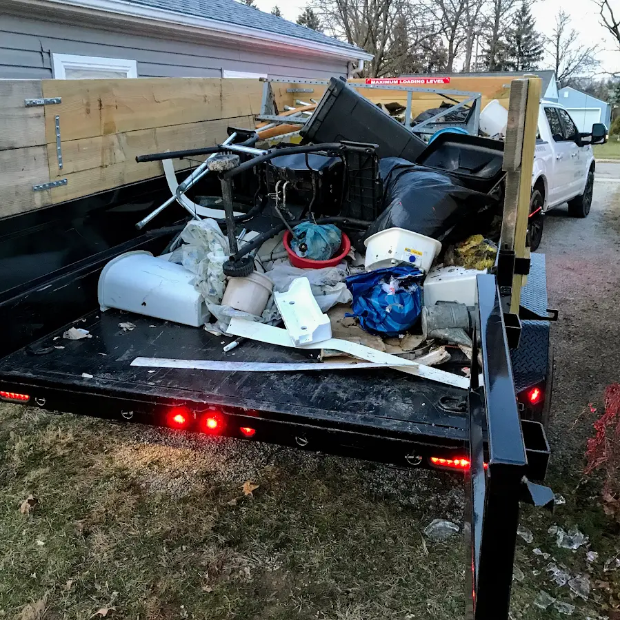 Roll-off dumpster delivered to a residential driveway in Iowa Falls