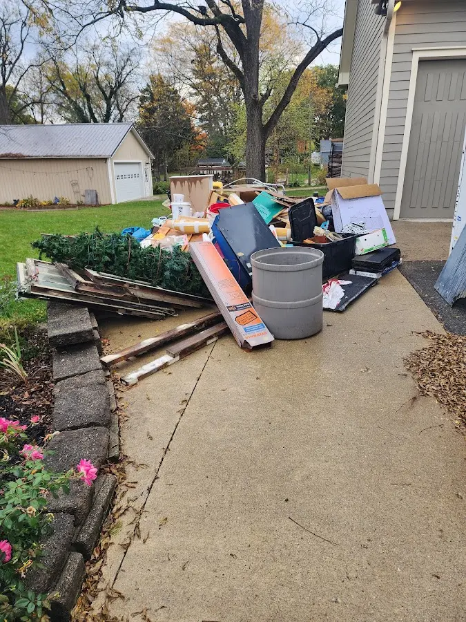 Dumpster being loaded with debris for Residential Dumpster Rental in Iowa Falls